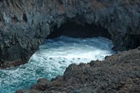 The natural park of los Volcanes in Lanzarote. The Cliffs of Los Hervideros. Click to enlarge the image in Adobe Stock (new tab).