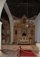 De stad Pájara in Fuerteventura. Het altaar van het schip van het Epistel van de kerk van Onze-Lieve-Vrouw. Klikken om het beeld te vergroten.