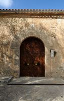 La ciudad de Petra en Mallorca - Portal del presbiterio de la iglesia de San Pedro. Haga clic para ampliar la imagen.