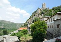 Fortress seen of the village of Pocitelj. Click to enlarge the image in Adobe Stock (new tab).