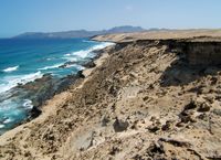 Het dorp La Pared in Fuerteventura. De kreek van Agua Liques (auteur serin2001). Klikken om het beeld te vergroten in Panoramio (nieuwe tab).
