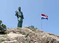 The statue of saint Pierre. Click to enlarge the image in Adobe Stock (new tab).