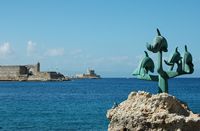 Dolphin statue in the harbor of Rhodes. Click to enlarge the image.