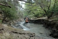 Draining the pond in the valley of the seven sources Rhodes. Click to enlarge the image.