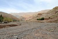 Valley of the drained wadi with Tasga. Click to enlarge the image in Adobe Stock (new tab).